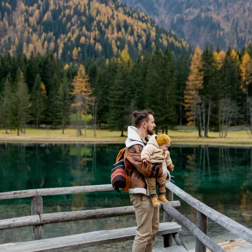 dad-holding-baby-woods