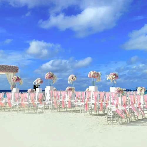 dest-wedding-emptychairsandarchinfrontofbeach02