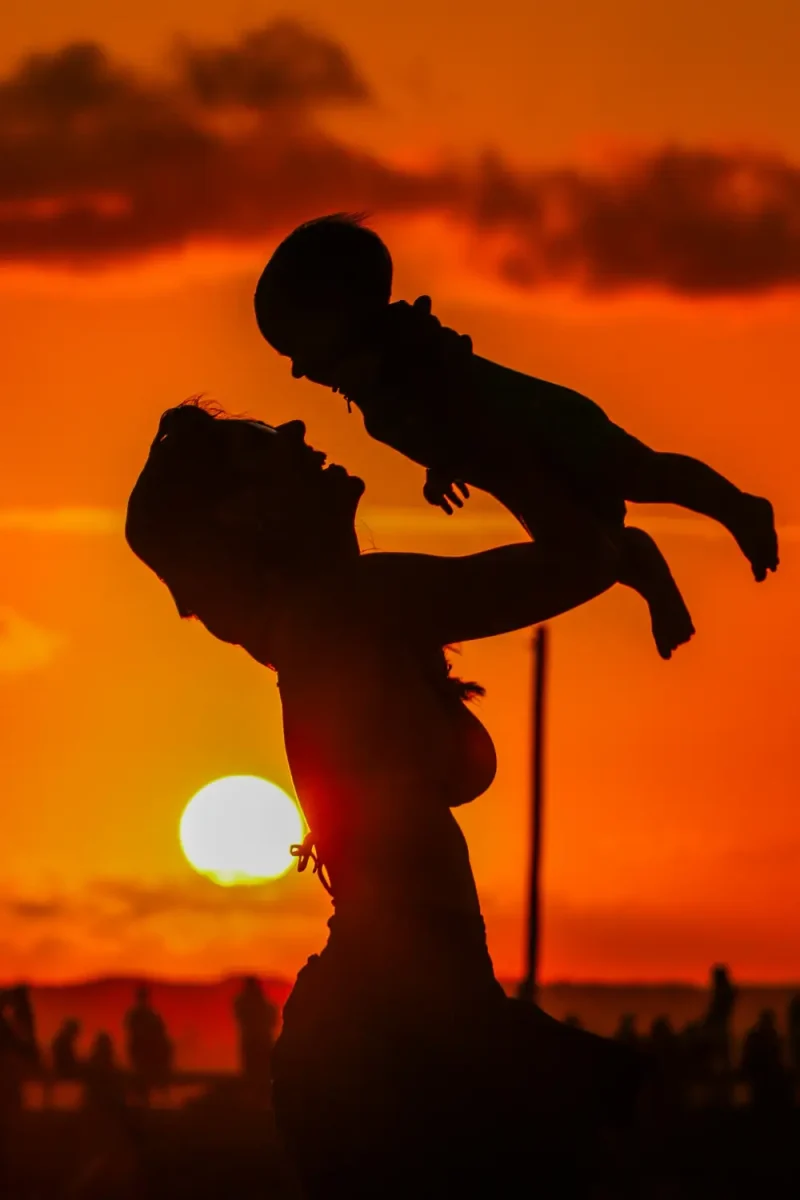 lady-swinging-a-baby-in-the-air-babyonright